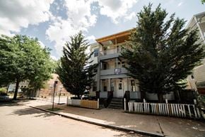 New Haven apartment for rent - A two-story house with a balcony and a porch.