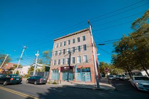 New Haven apartment for rent - A street view of a building with a sign that says "Welcome".