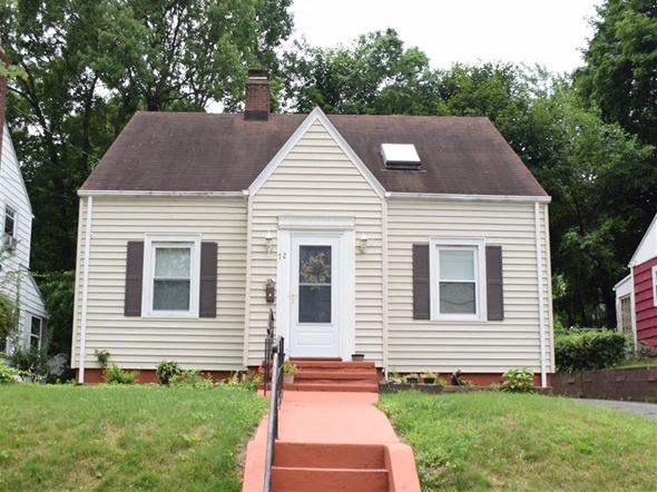 New Haven apartment for rent - A small house with a red brick walkway leading to the front door.
