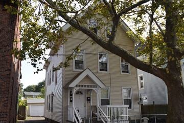 New Haven apartment for rent - A house with a white door and a porch.