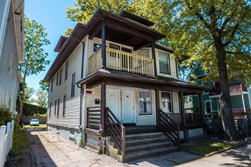 New Haven apartment for rent - A two-story house with a balcony on the second floor.