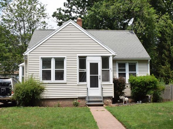 New Haven apartment for rent - A small white house with a grey roof and a grey door.