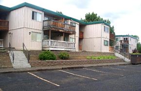 John Day apartment for rent - an empty parking lot in front of an apartment building