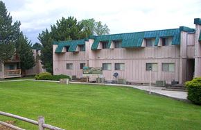 John Day apartment for rent - a building with a green lawn in front of it