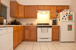 Oak Park apartment for rent - a kitchen with white appliances and wooden cabinets