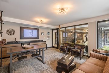 Chicago apartment for rent - a living room with a couch and a table and a tv