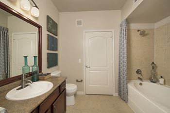Oversized roman tubs with ceramic tile surrounds