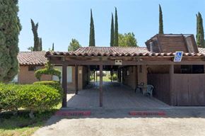 Delano apartment for rent - a building with a covered area with a bench