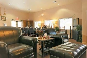 Avondale apartment for rent - a living room and dining room with leather furniture