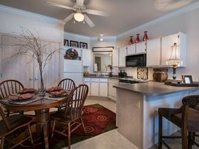 Derby apartment for rent - a kitchen and dining room with a table and chairs