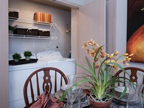 Derby apartment for rent - a dining room with a table with flowers and a sewing machine
