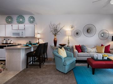 Grandview apartment for rent - a living room with a kitchen and a couch and chairs