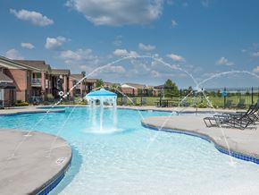 Grandview apartment for rent - a large swimming pool with a water fountain