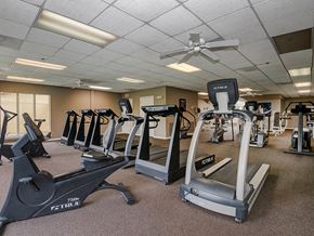Shawnee apartment for rent - a gym with plenty of exercise equipment at the enclave at university heights