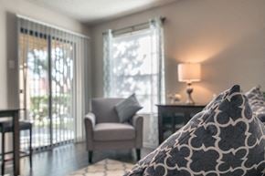 San Antonio apartment for rent - a bedroom with a bed and a chair and a window
