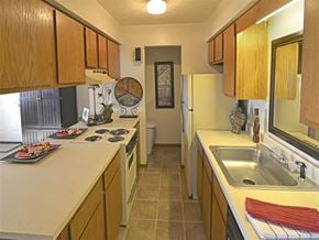 Joplin apartment for rent - a kitchen with a sink and a refrigerator