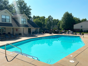 Rogers apartment for rent - a swimming pool with a house in the background