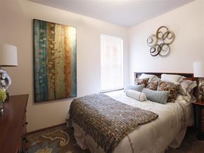 Rogers apartment for rent - a bedroom with a bed and a window