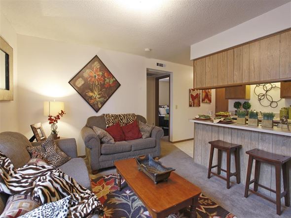 Rogers apartment for rent - a living room with a couch and a table