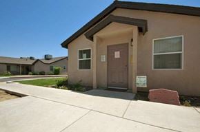 Shafter apartment for rent - a brown house with a brown door and a sidewalk
