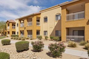 Glendale apartment for rent - an apartment building with a courtyard and bushes