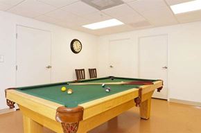 Glendale apartment for rent - a pool table in a room with two chairs