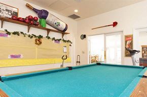 Delano apartment for rent - a pool table in a room with a door