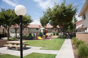 Fresno apartment for rent - a playground and picnic table in a park