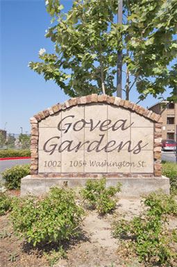 Bakersfield apartment for rent - a sign for golga gardens in front of a tree