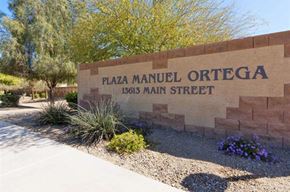 El Mirage apartment for rent - a sign for the plaza manuel oriental on a brick wall