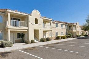 El Mirage apartment for rent - an empty parking lot in front of an apartment building