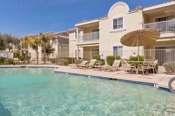 El Mirage apartment for rent - a large swimming pool in front of a building