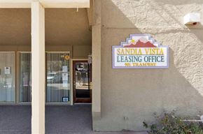 Albuquerque apartment for rent - a leasing office sign on the side of a building