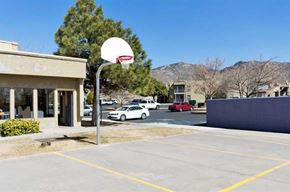 Albuquerque apartment for rent - a basketball hoop in the middle of a parking lot
