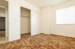 Porterville apartment for rent - an empty bedroom with a closet and a window