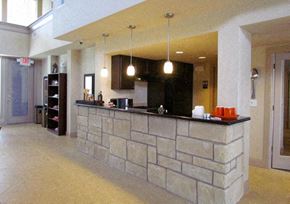 Houston apartment for rent - a large lobby with a stone bar in the middle