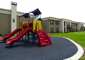 Houston apartment for rent - a playground in front of a building with slides