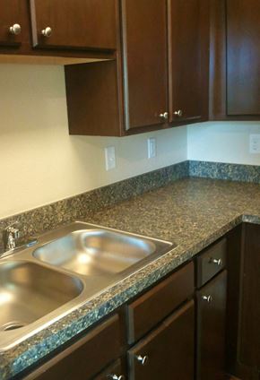 Houston apartment for rent - a kitchen with a sink and a counter top