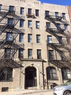 Astoria apartment for rent - a building with fire escapes on the side of it