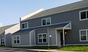 Lexington townhouse for rent - the front of a gray house with a blue roof