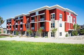 Madison apartment for rent - a modern apartment building with red and white exterior