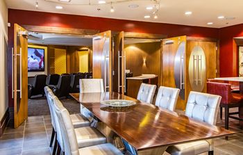Movie theater with surround sound, plush seating and popcorn