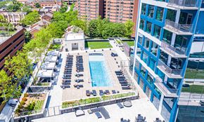 Baltimore apartment for rent - an aerial view of a swimming pool in the middle of an apartment building