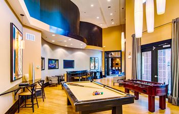 Game salon with billiards, foosball, refreshment bar and multiple flat screen tvs