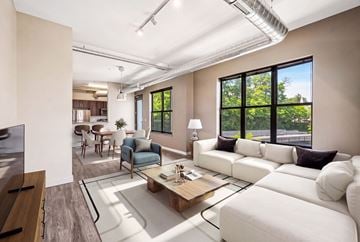 Plymouth apartment for rent - A living room with a white couch and a coffee table.