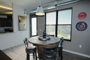 Plymouth apartment for rent - A dining room with a round table and chairs.