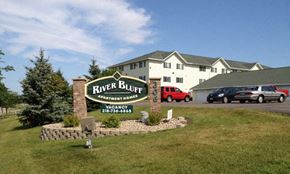 Fergus Falls apartment for rent - a river bluff resort sign in front of a building