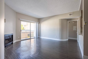 Burbank apartment for rent - an empty living room with wood floors and a fireplace