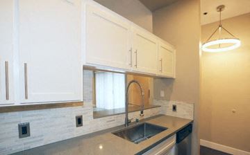 North Hollywood apartment for rent - a kitchen with a sink and white cabinets