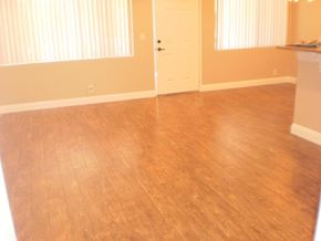 Studio City apartment for rent - a living room with a wooden floor and a door